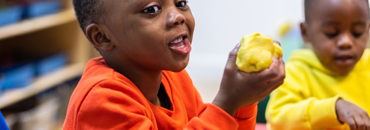 chatty toddler with playdough